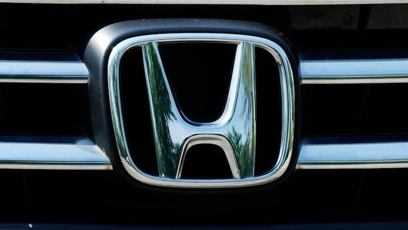 FILE - A Honda logo is seen on a Honda accord vehicle at a parking lot in Arlington Heights,...