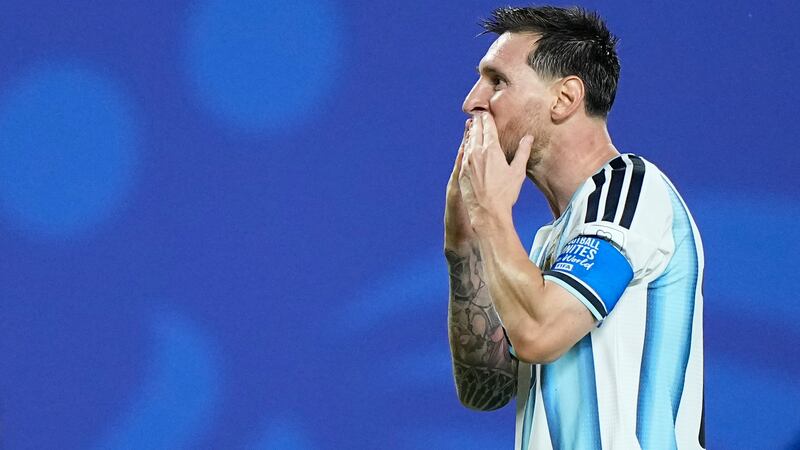 Argentina's Lionel Messi reacts after scoring his third goal during the World Cup Group J...
